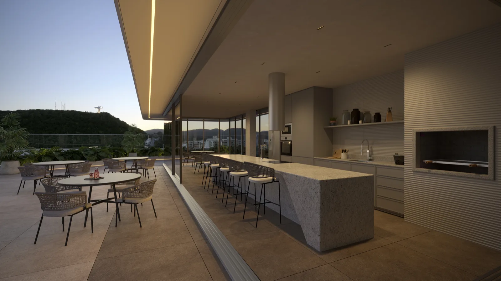 Espaço gourmet com mesas e iluminação decorativa